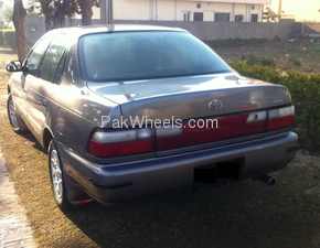 Slide_toyota-corolla-1999-890935